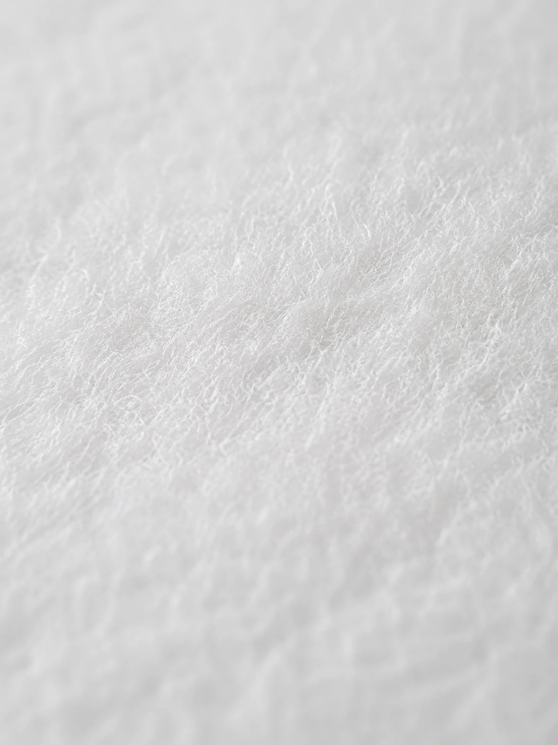 Close-up of soft white cotton nonwoven fabric